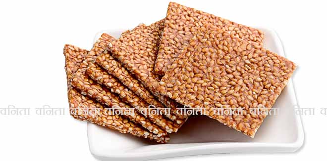 Indian traditional sweet called Till patti or chikki and sesame isolated on white background 