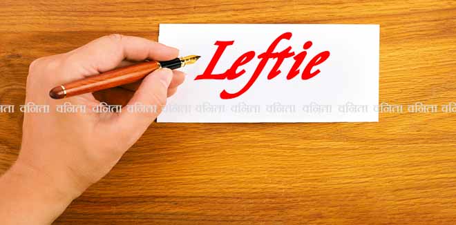 Woman writing by left hand. Left hander day concept.